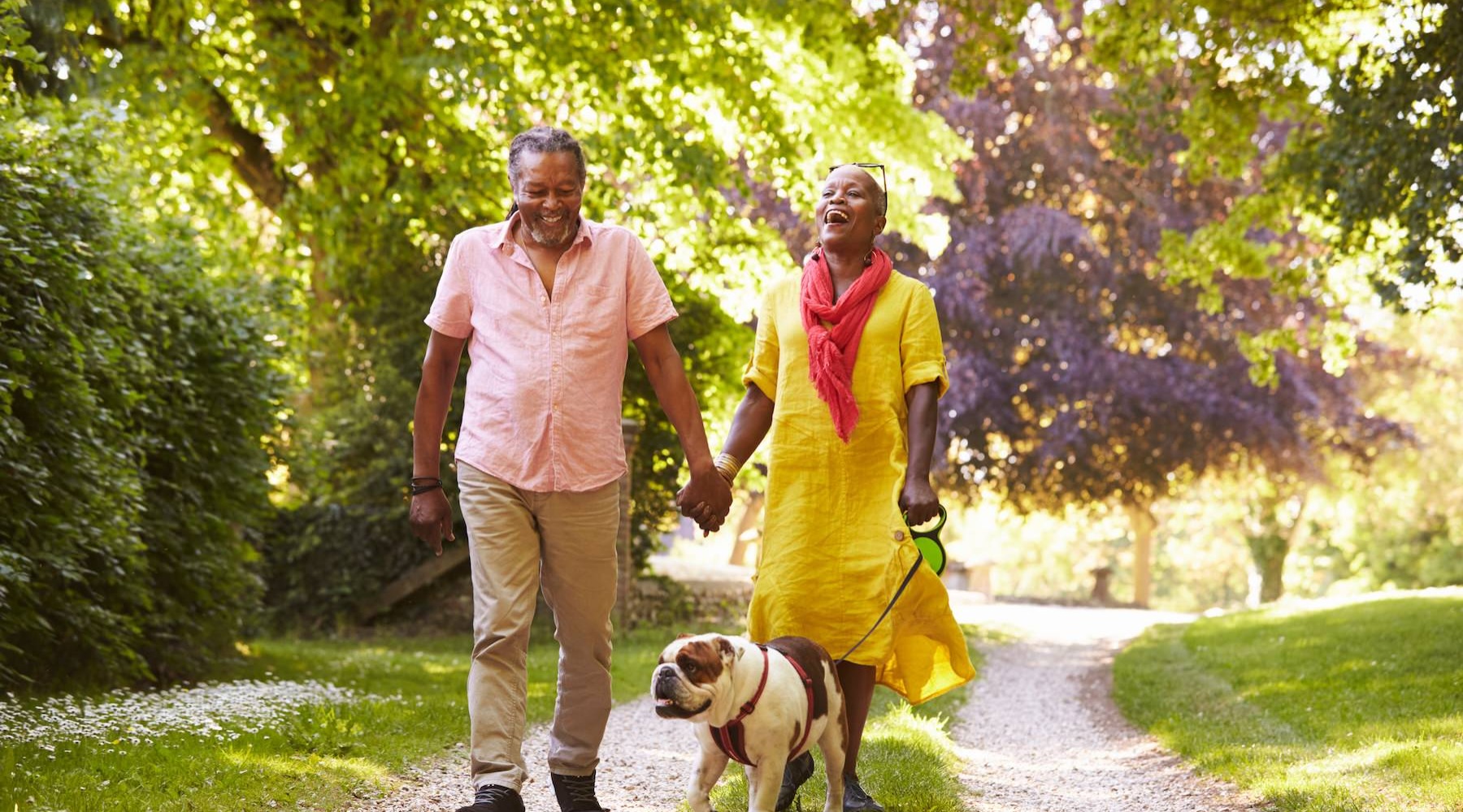 Settle into comfort at Vista Riverwest couple walking a dog
