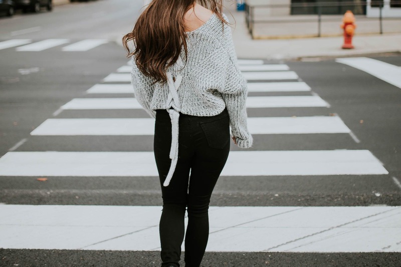 a person walking in a crosswalk